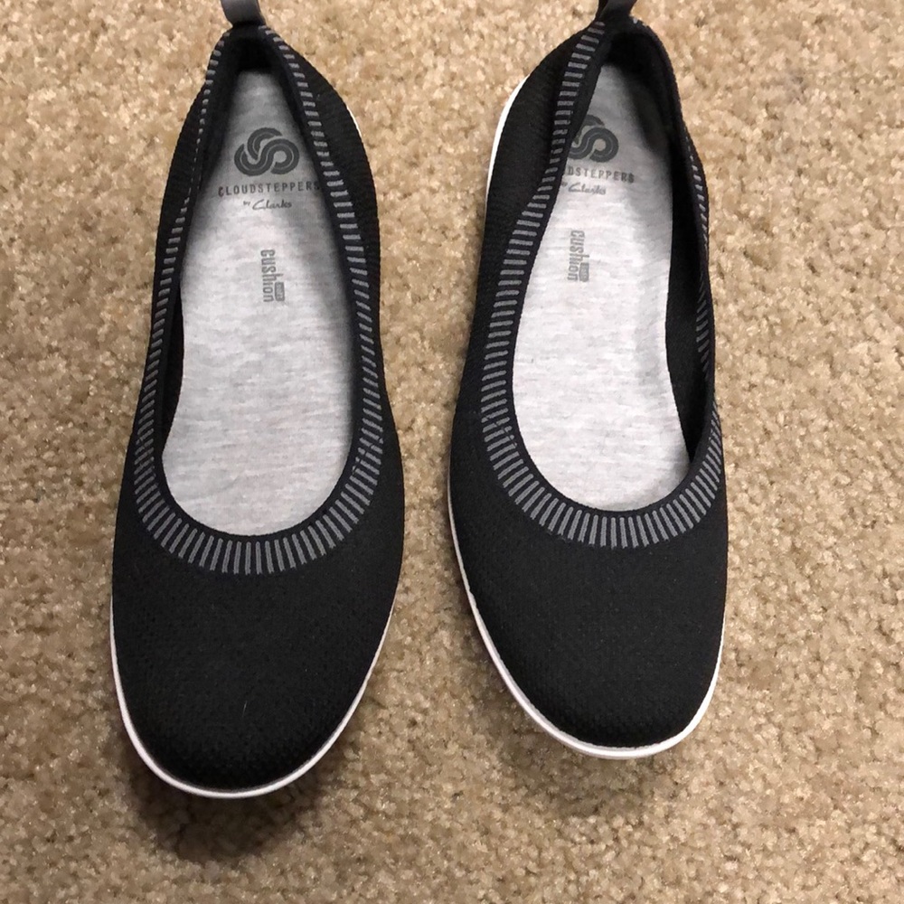 Black shoes. White soles, cushion inserts
